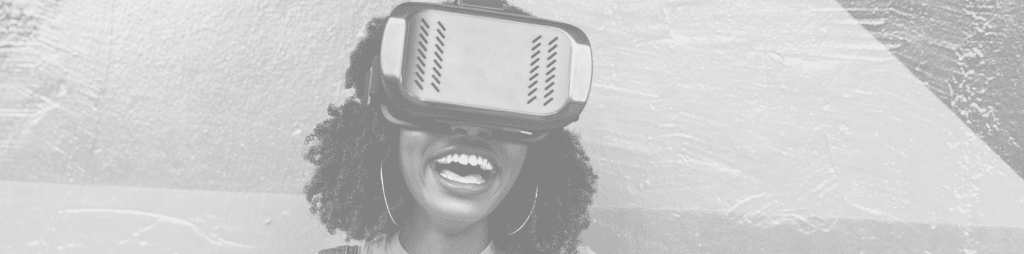 Woman wears VR headset smiling.