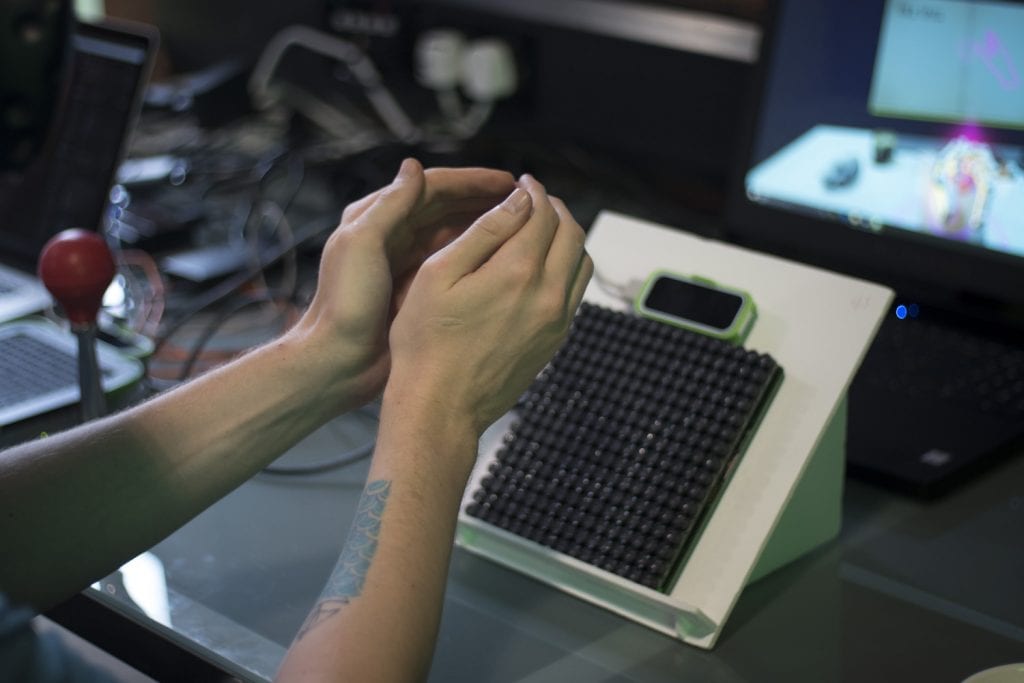 A person using a Leap Motion to detect the movement of the hands